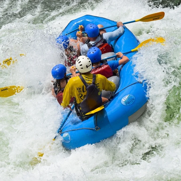 rafting team riding strong rapids in costa rica with wave expeditions