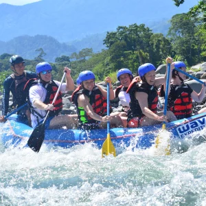 Group enjoying whitewater rafting in Costa Rica with Wave Expeditions guides