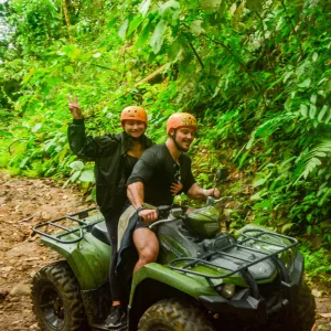 Couple on a double ATV posing in the rainforest of La Fortuna