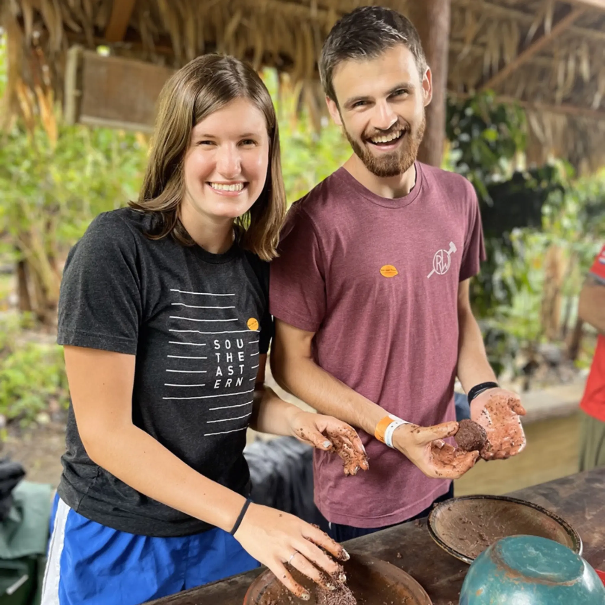 Young couple learning to make chocolate from cacao beans in Costa Rica